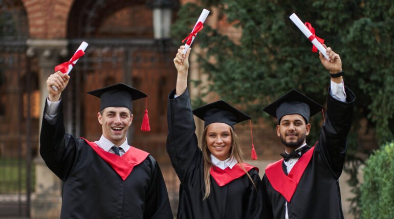 international graduates from celebrating diplomas graduation robes 1 scaled e1768207324377